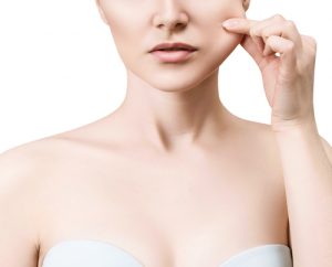 Woman pulling her facial skin with her fingers