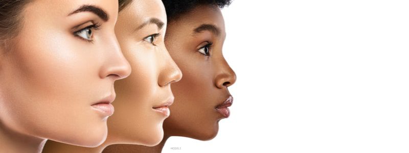 Three women of different ethnicities with perfect complexions