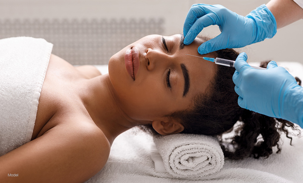 Woman getting a facial injection