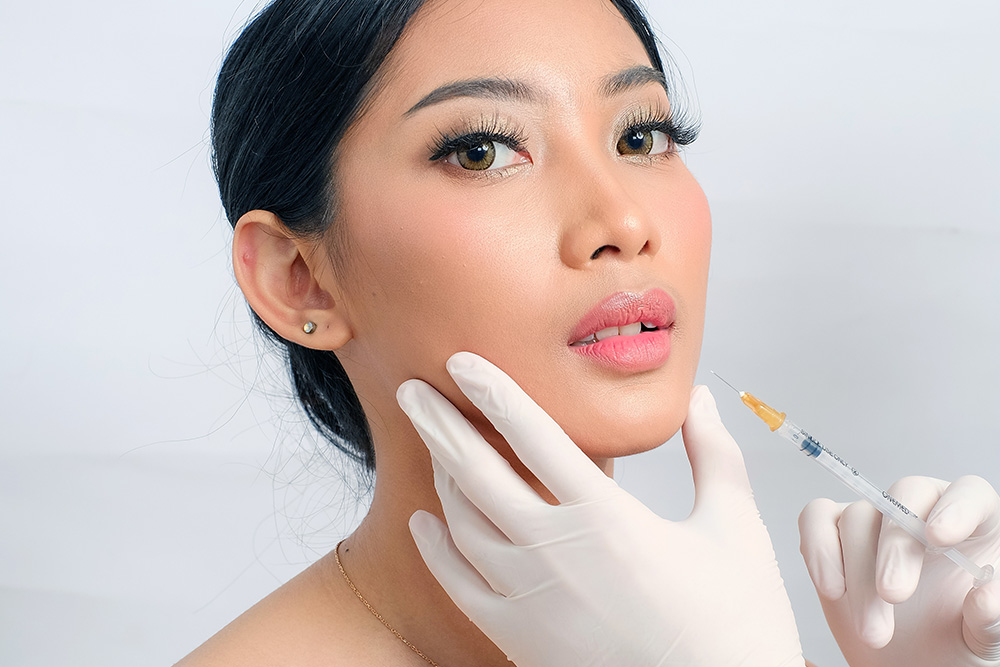 Woman getting a face injection