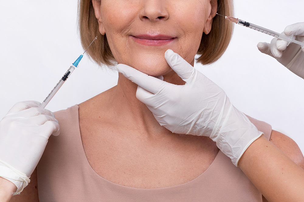 Woman getting multiple facial injections